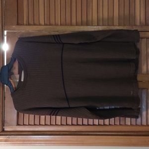 A green and blue light sweater